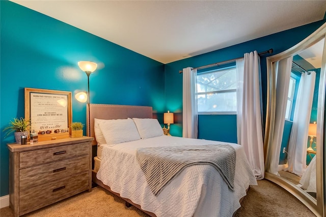 bedroom featuring light colored carpet