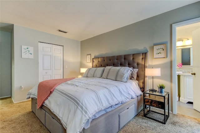 bedroom featuring light carpet and a closet