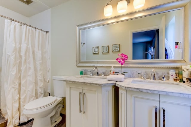 bathroom with a shower with shower curtain, vanity, and toilet