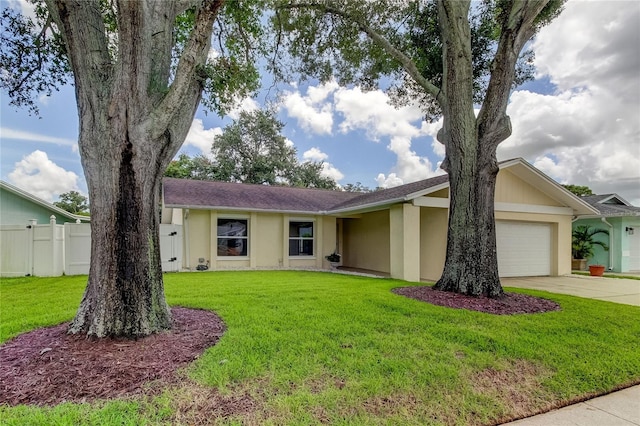 ranch-style home with a garage and a front yard