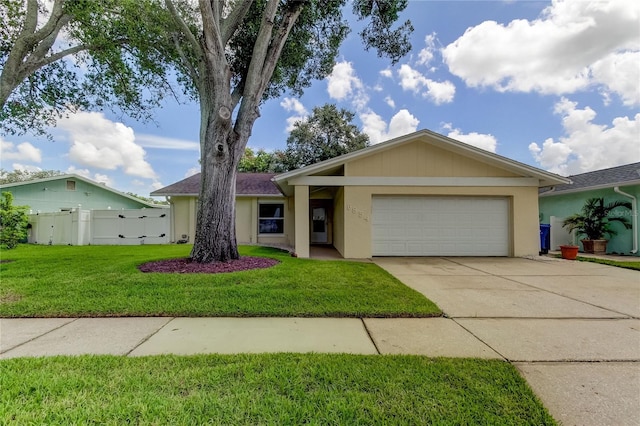 single story home with a front yard and a garage