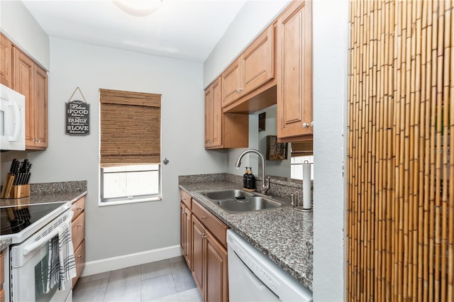 kitchen featuring white appliances and sink