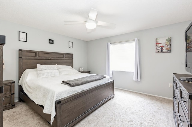 bedroom with ceiling fan and light colored carpet