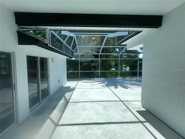 view of patio with a lanai