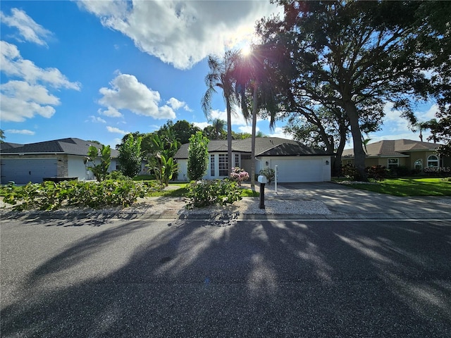 single story home featuring a garage