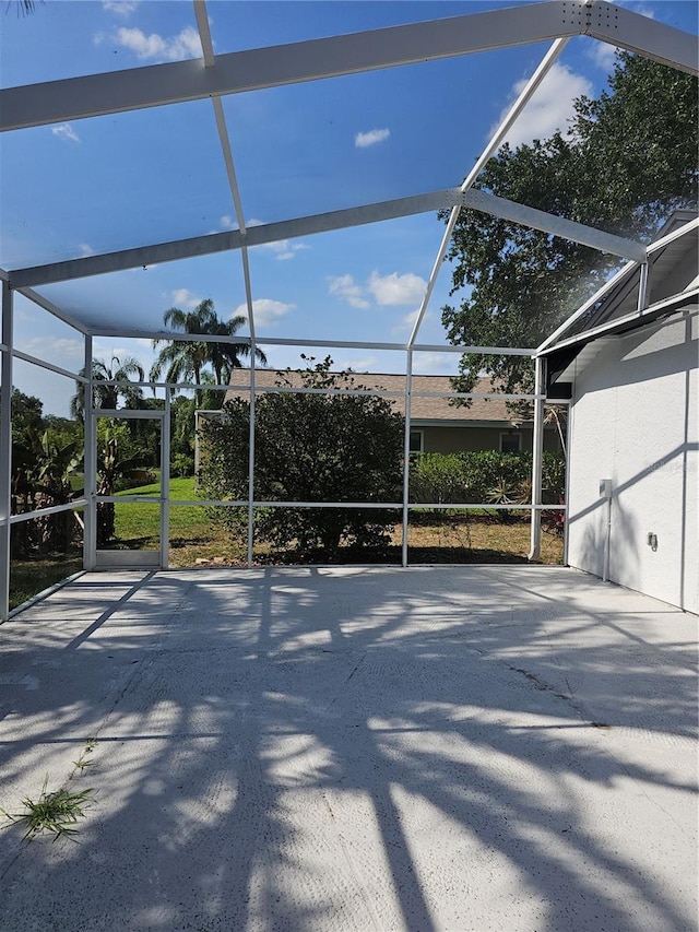 view of patio / terrace featuring a lanai