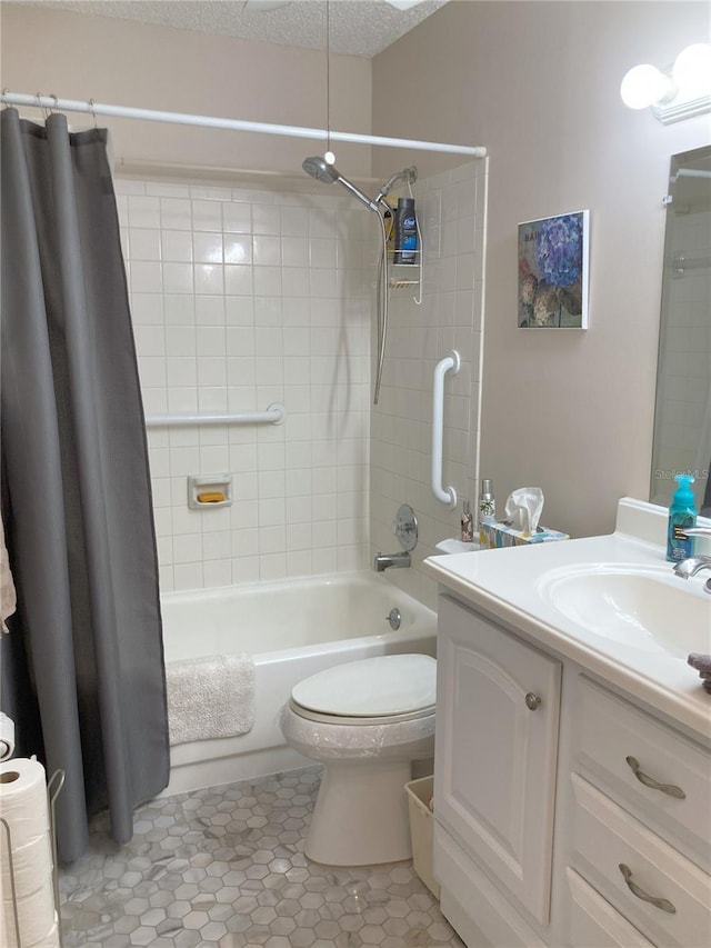 full bathroom featuring vanity, a textured ceiling, shower / tub combo with curtain, tile patterned flooring, and toilet