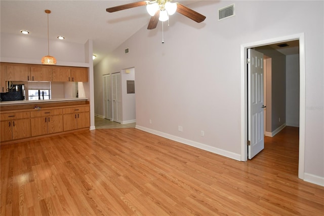 interior space featuring lofted ceiling, ceiling fan, and light hardwood / wood-style floors