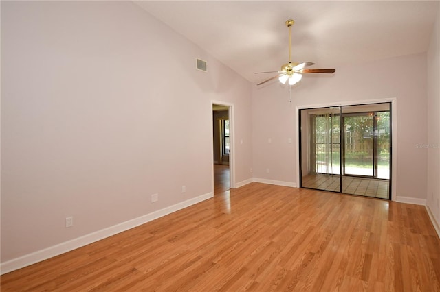 unfurnished room with ceiling fan, high vaulted ceiling, and light wood-type flooring