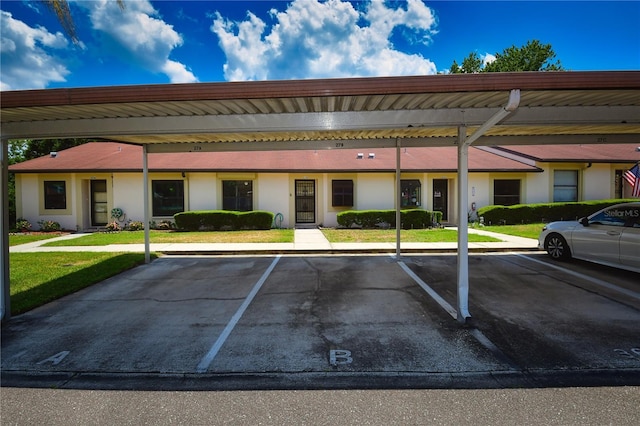 view of parking featuring a carport