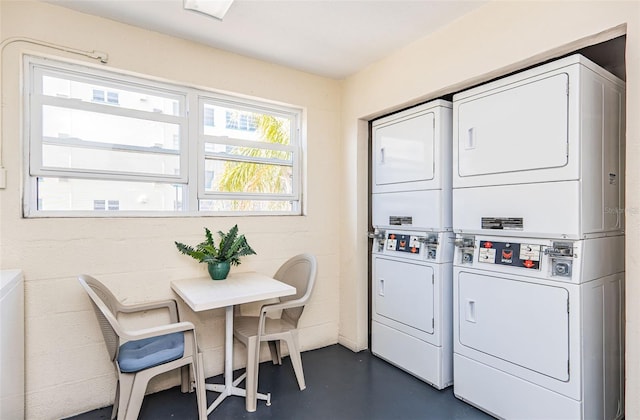 washroom with stacked washer and dryer