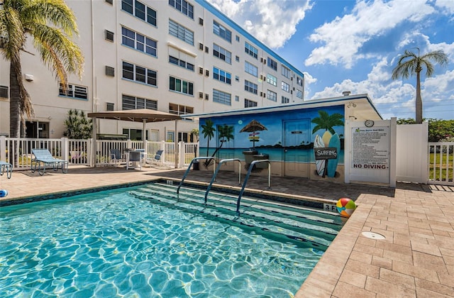 view of swimming pool with a patio