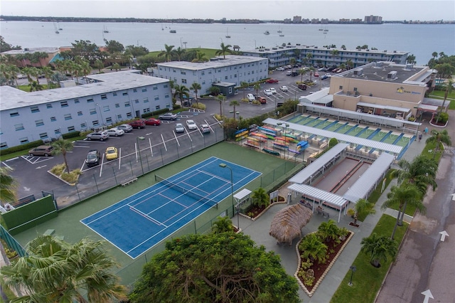 birds eye view of property with a water view