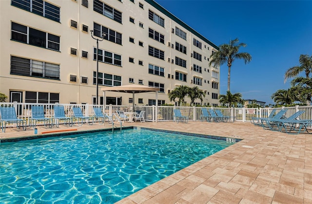 view of swimming pool with a patio