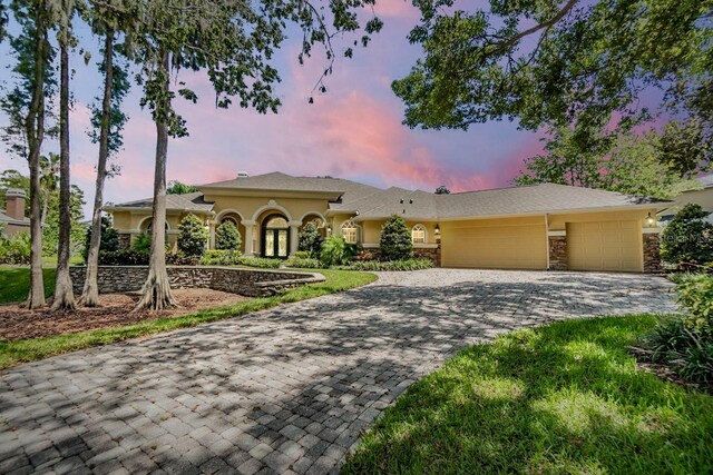 view of front of property with a garage