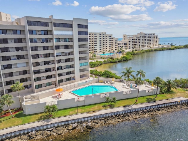 view of pool with a water view