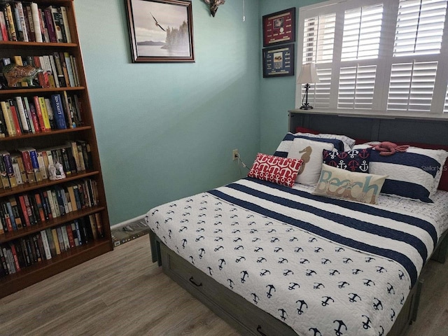 bedroom featuring wood finished floors