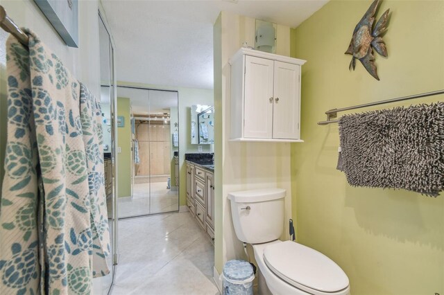 6035 Sea Ranch Dr Unit 505, Hudson, FL 34667 - bathroom with vanity, toilet, and tile patterned flooring