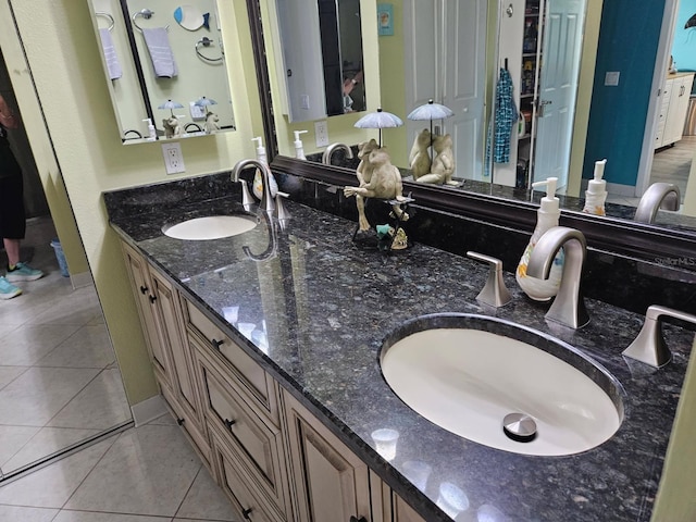 6035 Sea Ranch Dr Unit 505, Hudson, FL 34667 - bathroom featuring double vanity, tile patterned floors, and baseboards