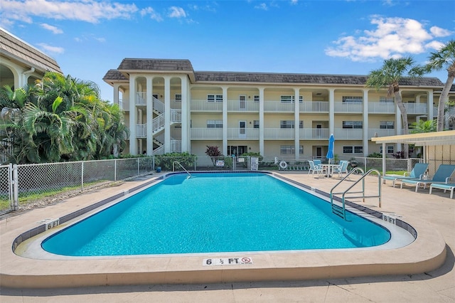 view of swimming pool with a patio