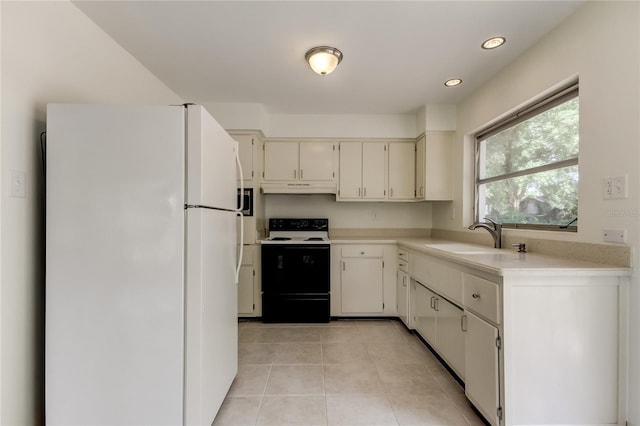 kitchen with sink, light tile patterned floors, and white appliances