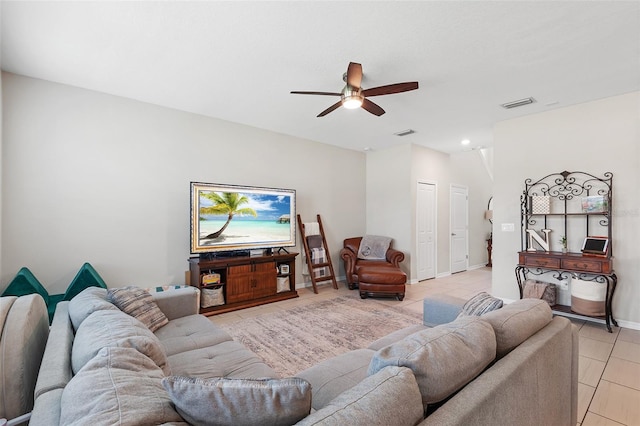 living room with ceiling fan and light tile patterned floors