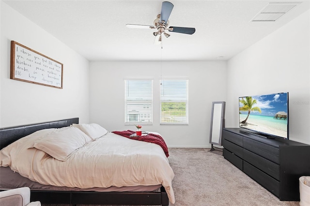 bedroom with light carpet and ceiling fan