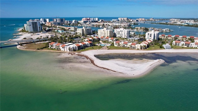 aerial view with a water view and a beach view