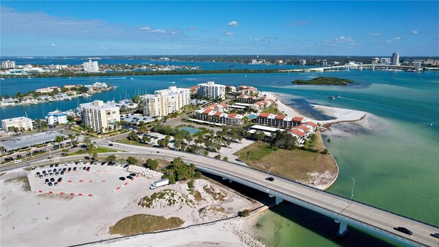 aerial view featuring a water view and a beach view