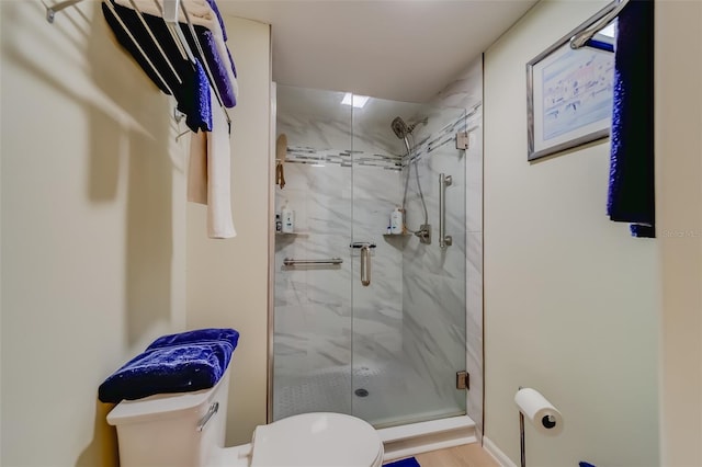 bathroom featuring hardwood / wood-style flooring, toilet, and walk in shower