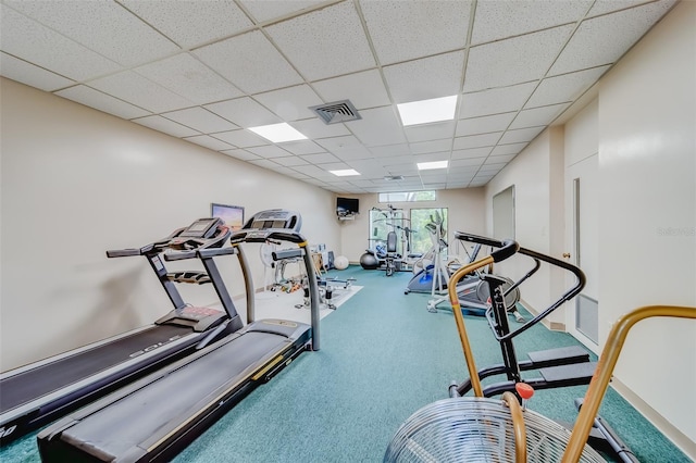 gym featuring a paneled ceiling