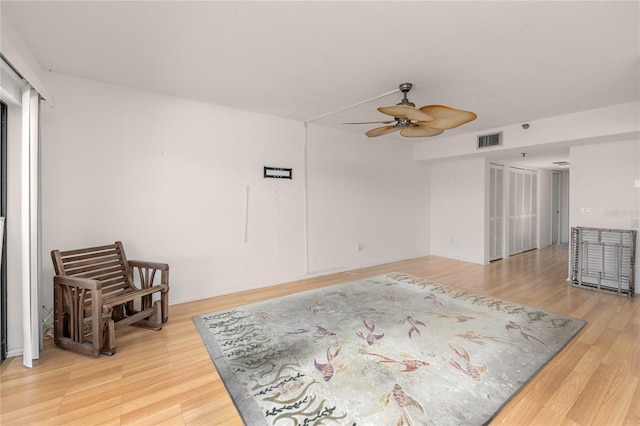 interior space with ceiling fan and hardwood / wood-style floors