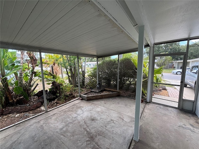 unfurnished sunroom featuring plenty of natural light