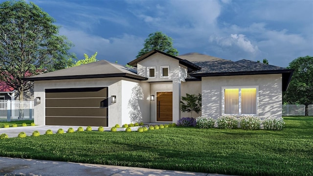 view of front of house featuring a front lawn and a garage