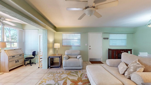 tiled living room featuring ceiling fan