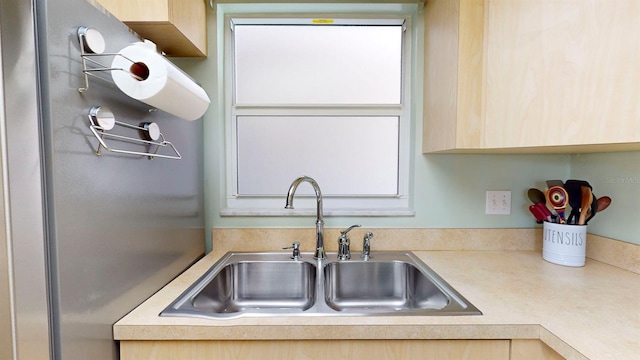 kitchen with light brown cabinets and sink