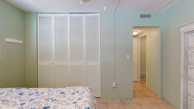 bedroom with light tile patterned floors