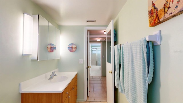 bathroom with tile patterned flooring and vanity