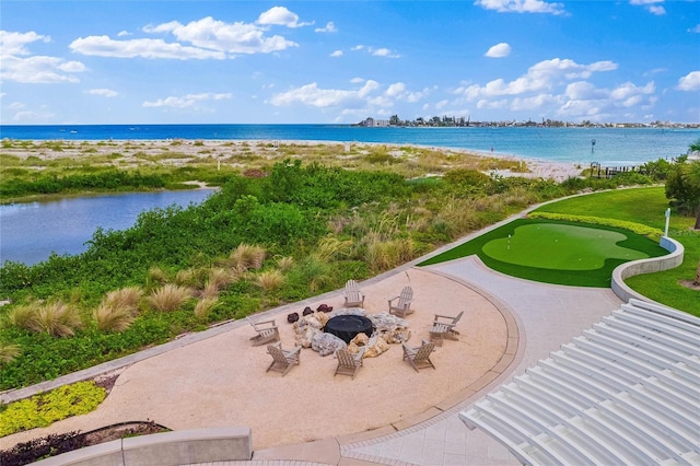 property view of water featuring a fire pit