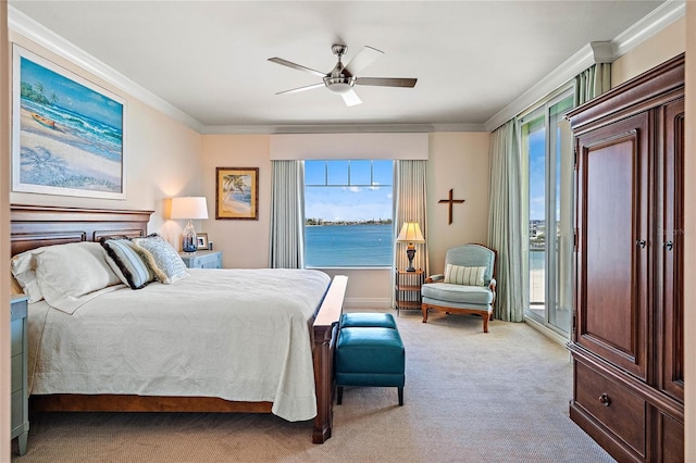 carpeted bedroom featuring access to exterior, a water view, ceiling fan, and crown molding