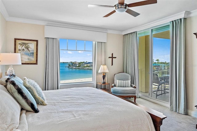 bedroom with carpet, ornamental molding, access to outside, ceiling fan, and a water view