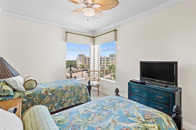 carpeted bedroom with ceiling fan and crown molding