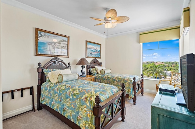 bedroom with ceiling fan, carpet floors, and ornamental molding