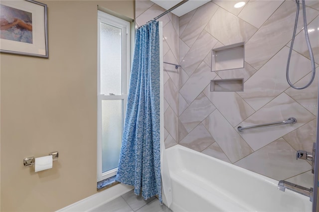 bathroom featuring tile patterned floors and shower / bath combo