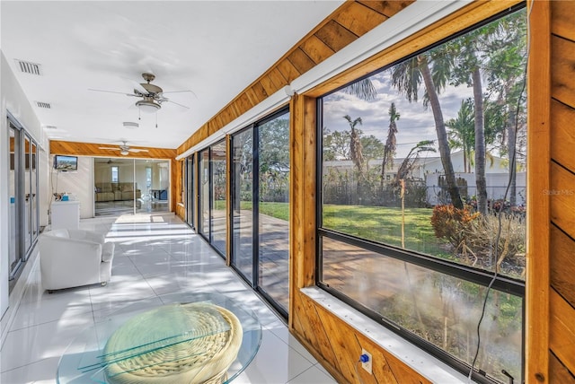 sunroom / solarium with ceiling fan