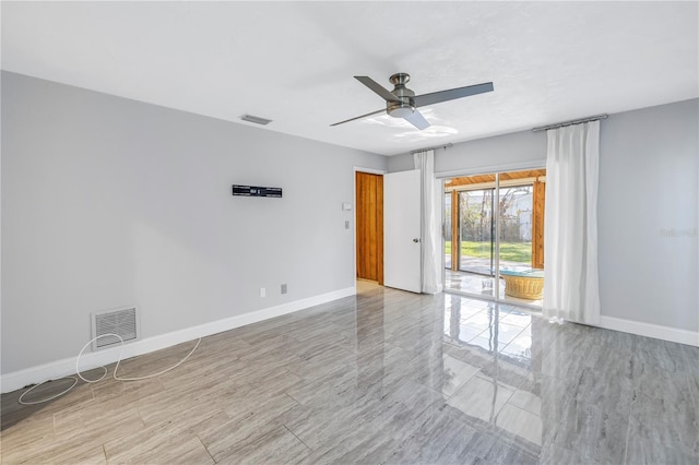 spare room with ceiling fan