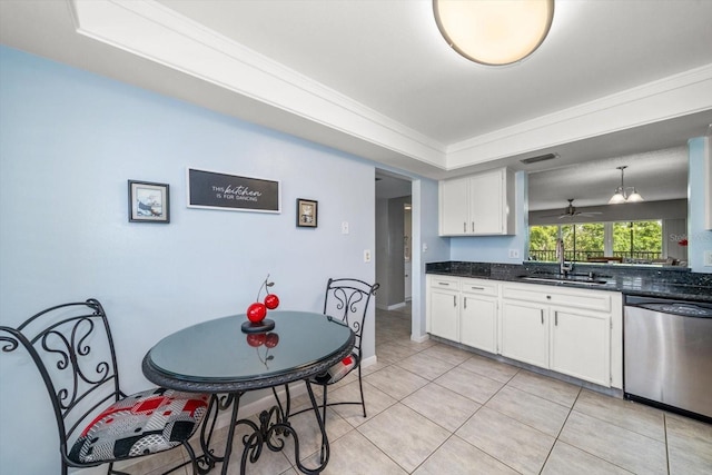 kitchen with stainless steel dishwasher, ceiling fan, sink, white cabinetry, and hanging light fixtures