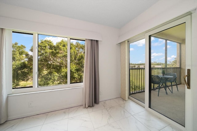 spare room with plenty of natural light