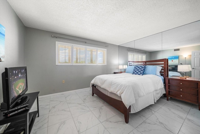 bedroom with a textured ceiling