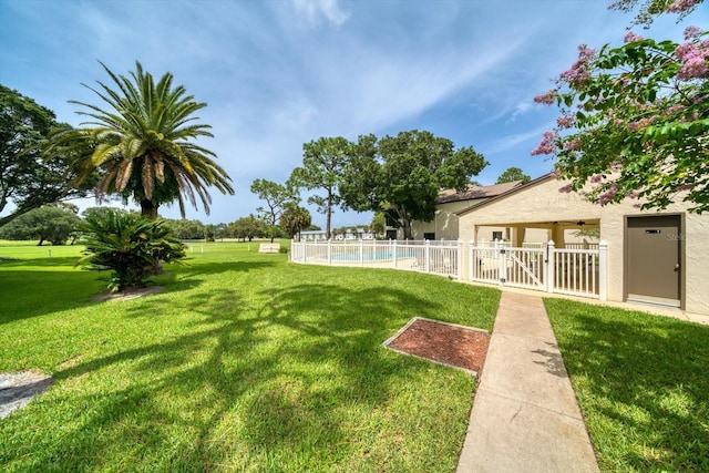 view of yard with a fenced in pool